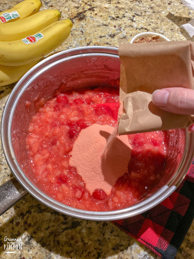 adding Jello to pie filling in pan
