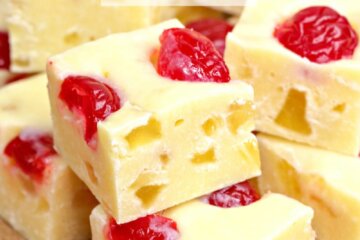 Homemade fudge is always a treat, and this Pineapple Upside Down Fudge is a unique recipe when you're looking for something beyond the usual chocolate and vanilla flavors. This no bake pineapple fudge is filled with cherries and tastes just like pineapple upside down cake! It's so much fun to make and eat!