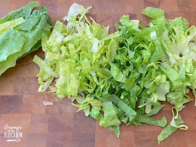 chopped romaine lettuce on cutting board
