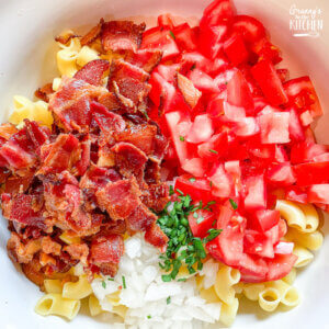 bacon pasta salad ingredients in mixing bowl