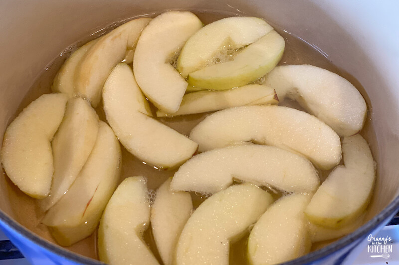 apple slices cooking on stovetop