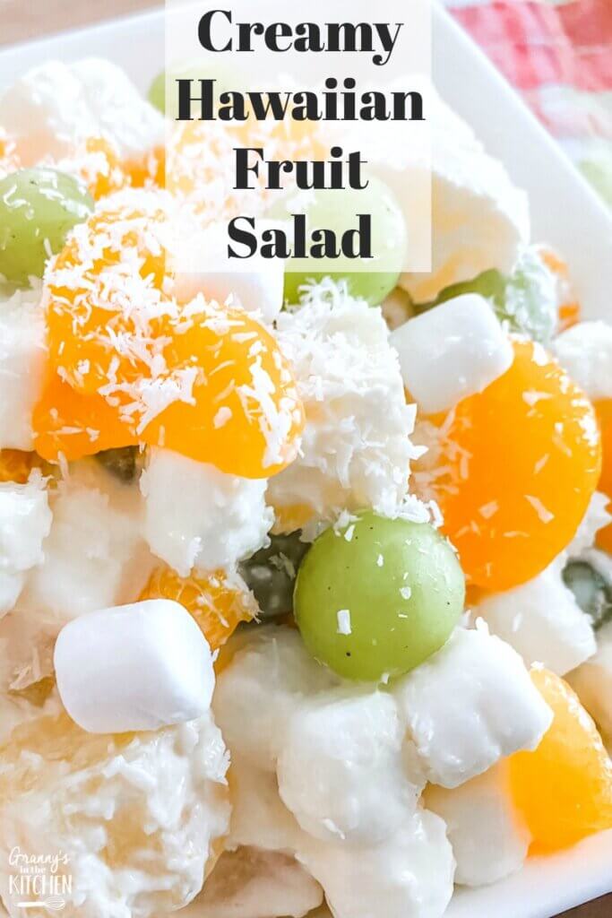 fruit salad with mandarins, pineapple, grapes, and marshmallows