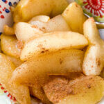 cooked cinnamon apples in bowl