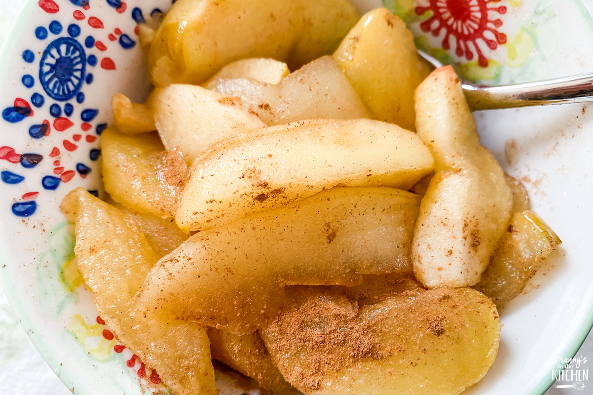 cooked cinnamon apples in bowl