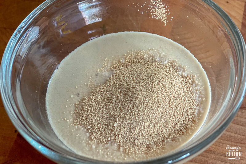 dissolving yeast in bowl of water