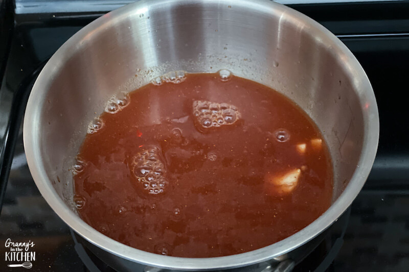 cooking homemade barbecue sauce in saucepan