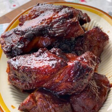 oven baked country style ribs on plate with barbecue sauce