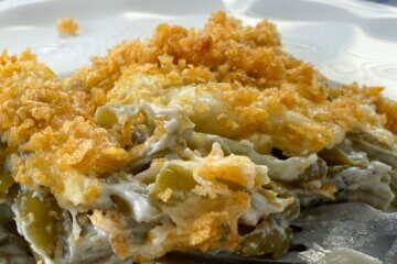 green bean casserole on plate with crispy topping