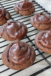 chocolate cherry cookies on wire cooling rack