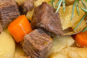 beef stew in bowl; text overlay "Classic Beef Stew"