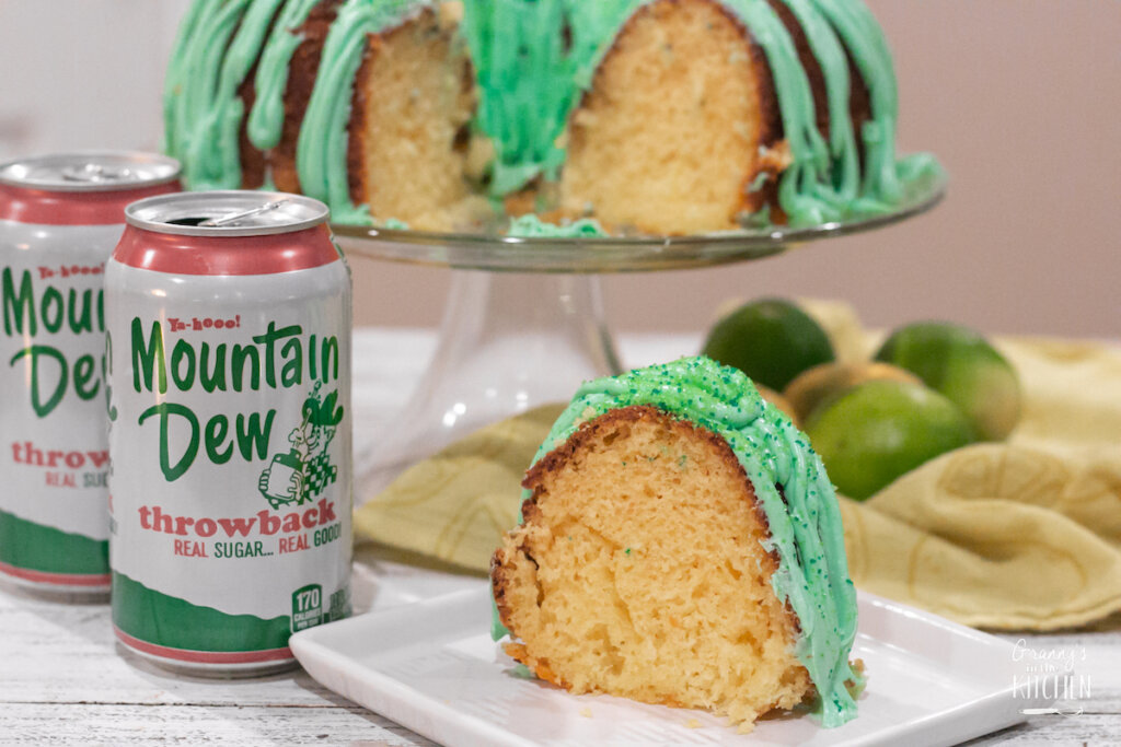 Lemon bundt cake with green frosting and a can of Mountain Dew