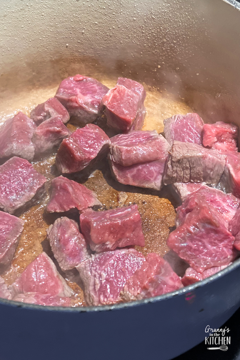 browning beef cubes in dutch oven pot
