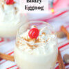 homemade eggnog with whipped cream and cherry