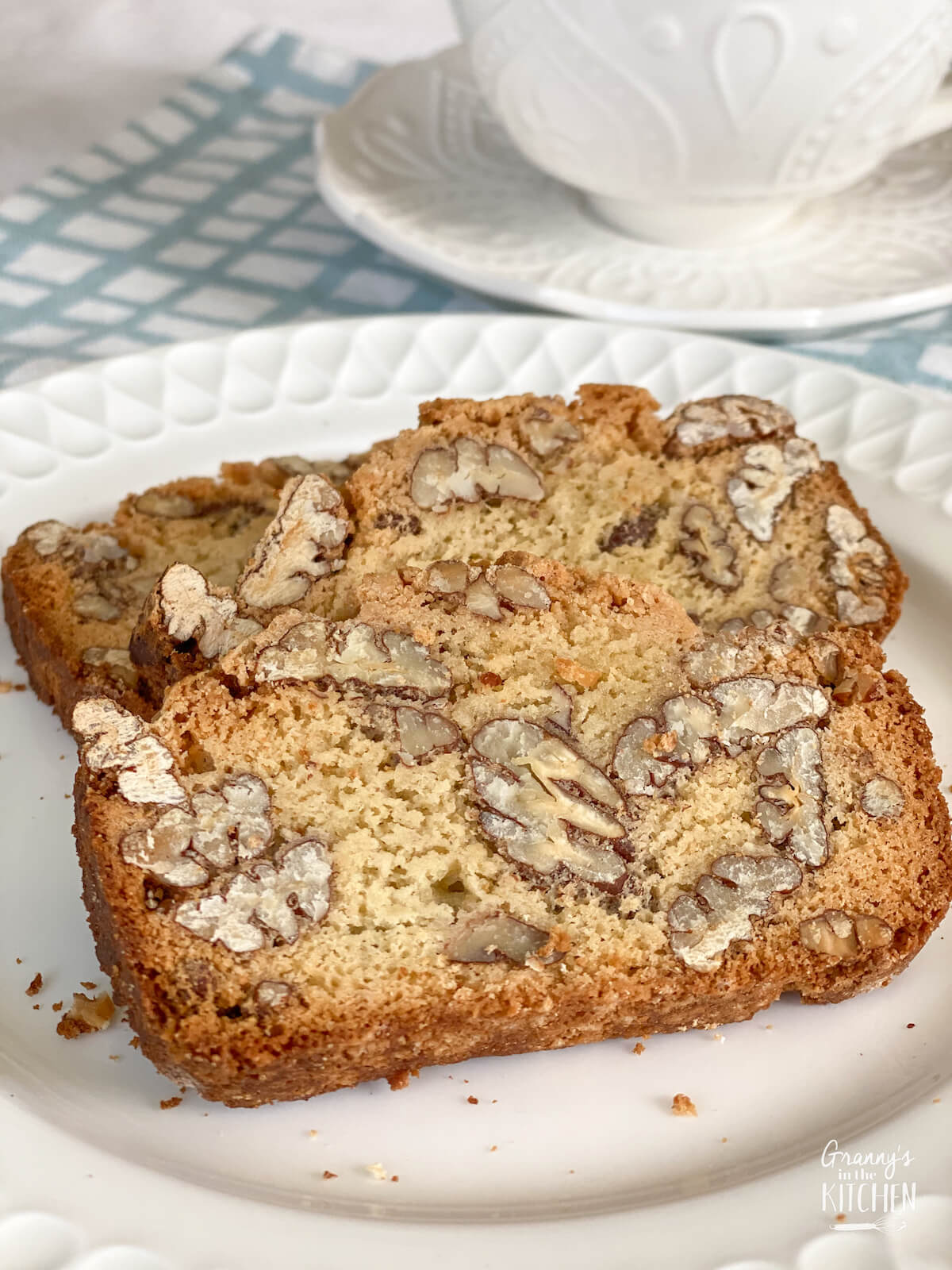 two slices of pecan biscotti with coffee