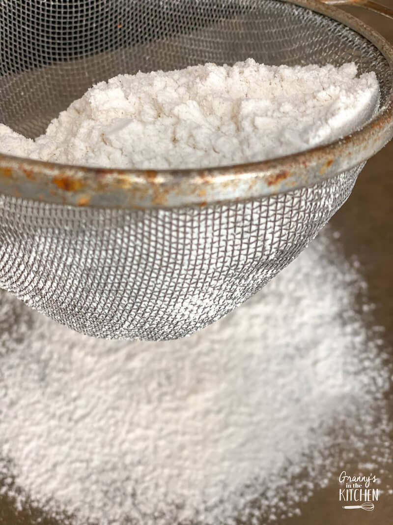 sifting flour with mesh strainer