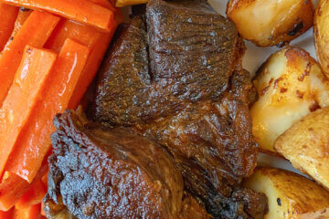 pot roast with carrots and potatoes, text overlay "Old Fashioned Pot Roast"