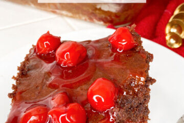 chocolate cake topped with cherries; text overlay "Cherry Chocolate Cake"