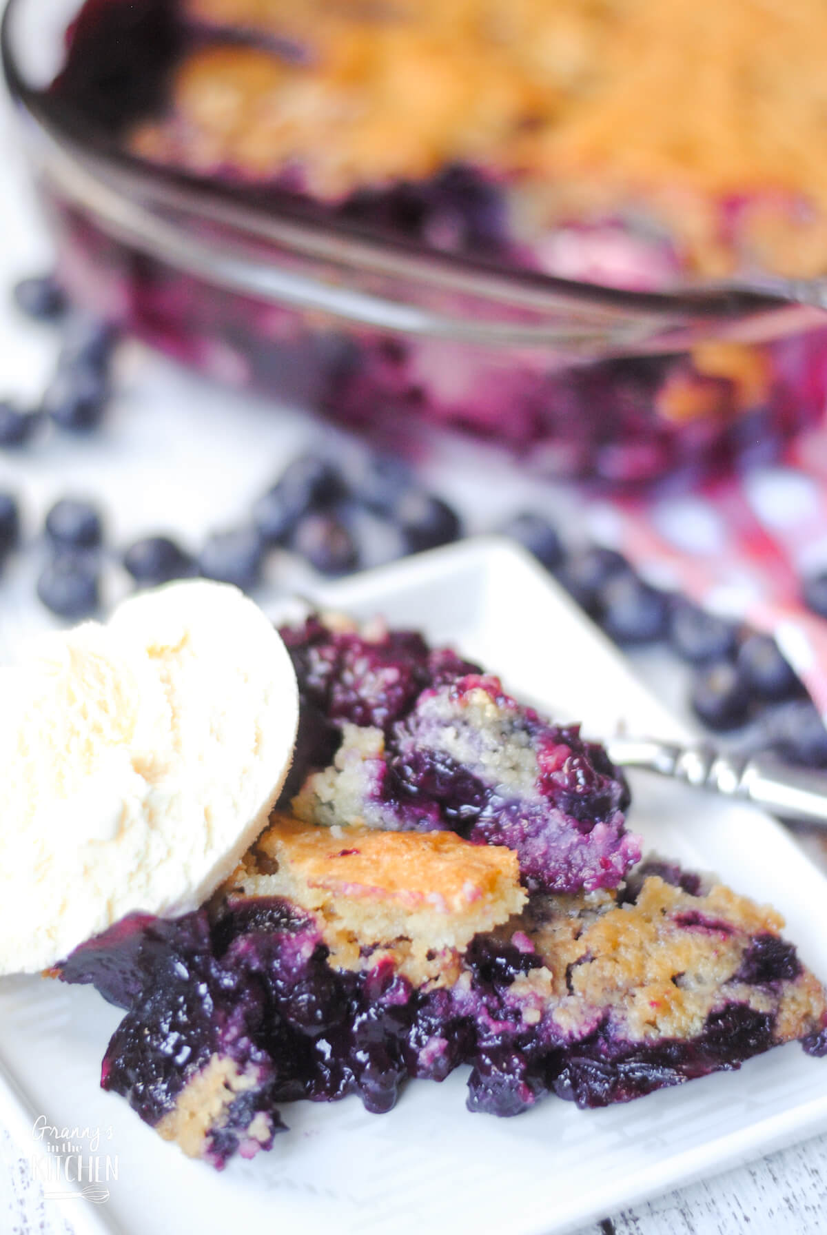 blueberry cobbler on plate with ice cream