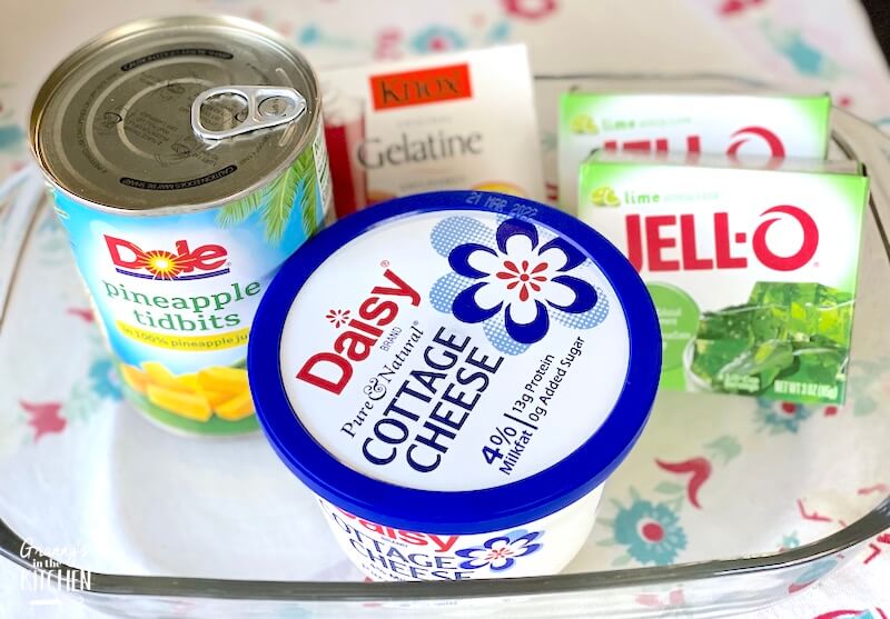jello boxes, pineapple can, and cottage cheese container in a baking dish