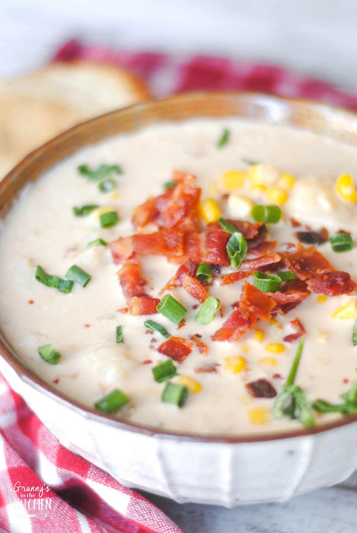 bowl of homemade corn chowder with potatoes and bacon