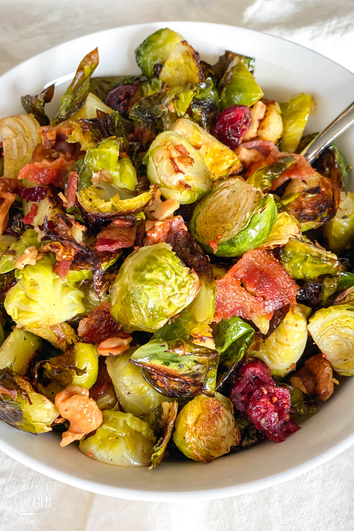 bowl of roasted Brussel Sprouts with cranberries and bacon