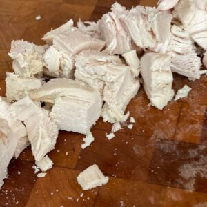 chopped chicken breast on cutting board