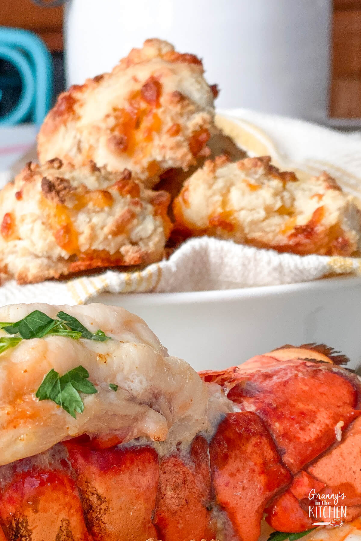 basket of cheddar biscuits with lobster tail