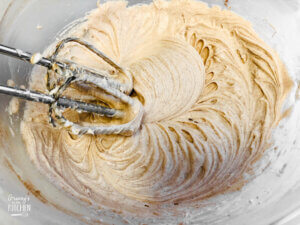 mixing cinnamon cream cheese icing with egg beaters