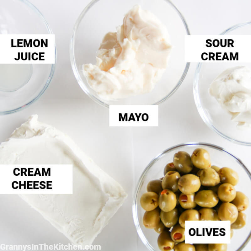 ingredients to make olive cheese dip, with labels