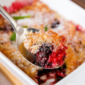 Close up photo of a spoonful of Bisquick Blackberry Cobbler