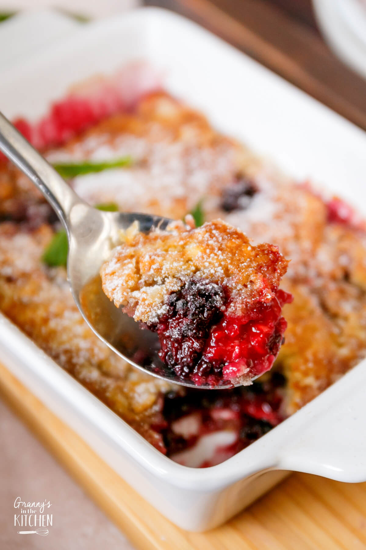 Close up photo of a spoonful of Blackberry Cobbler