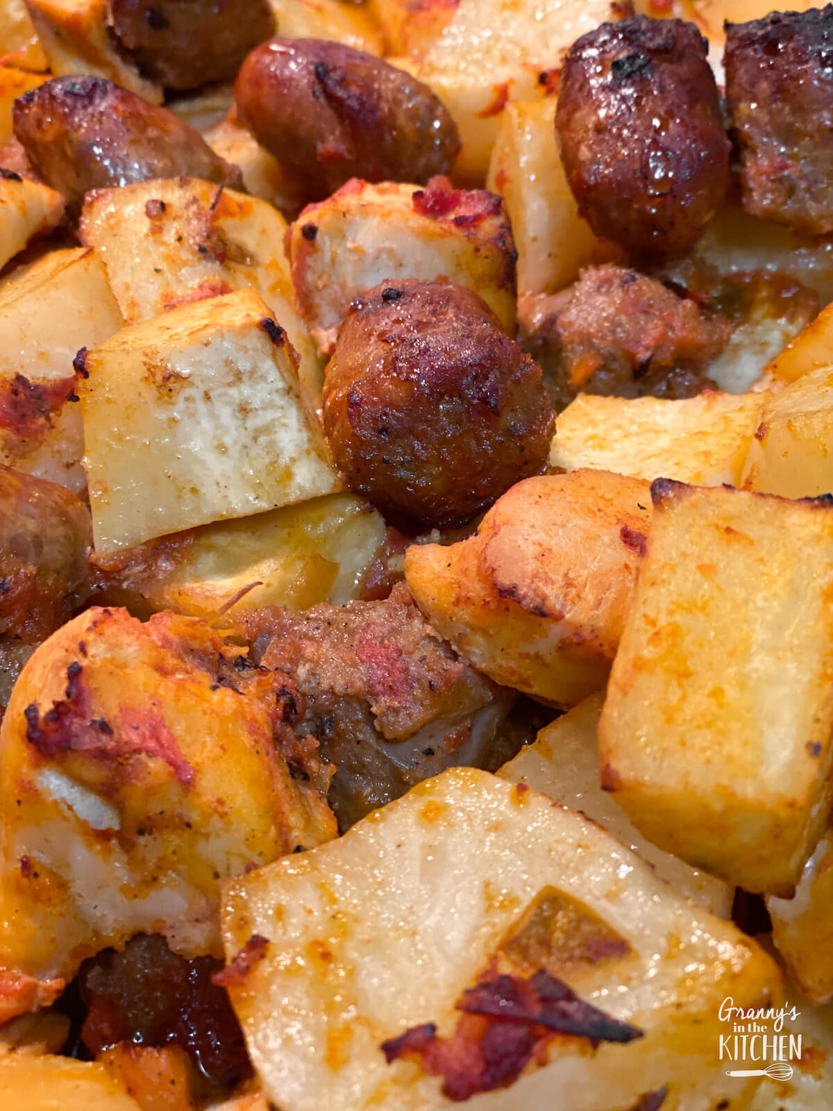 close up of roasted chicken sausage and potatoes