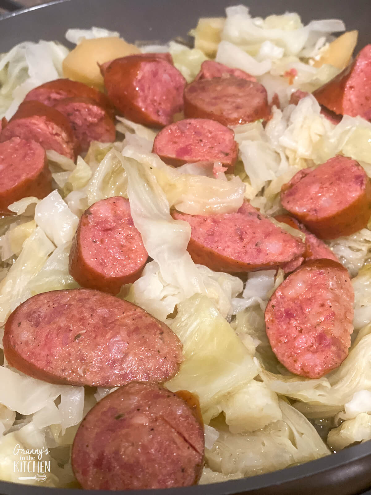 sausage and cabbage in a skillet