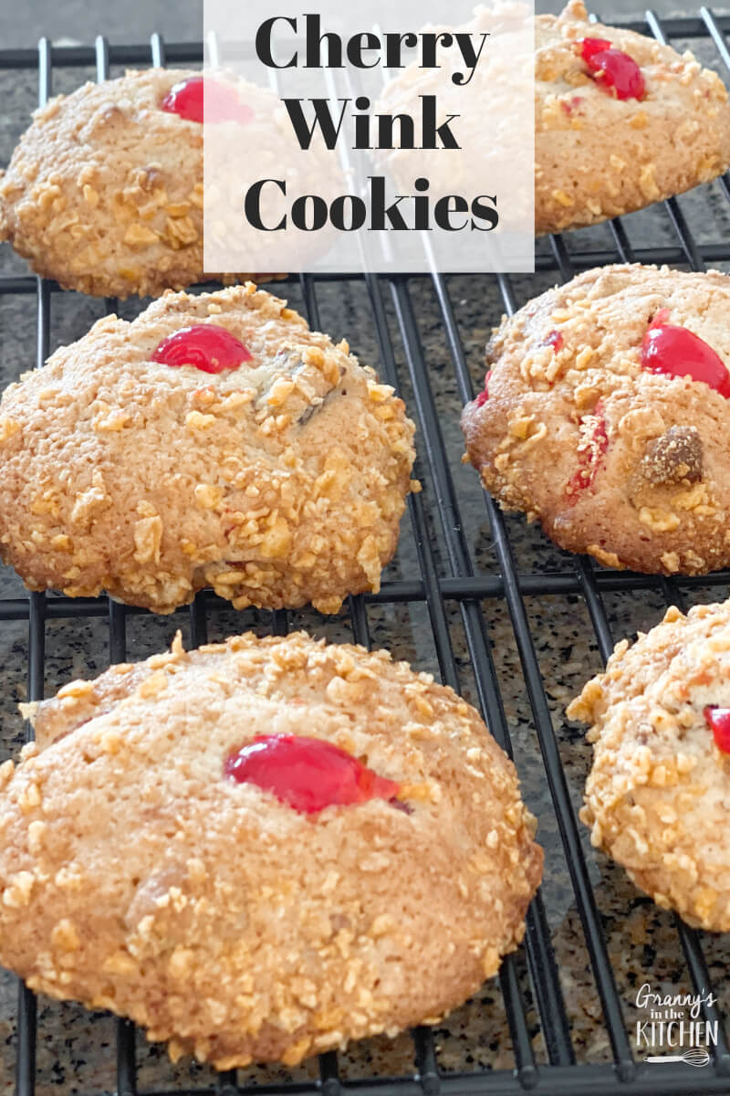 cookies on a wire rack with cherry on top; text overlay "Cherry Wink Cookies"
