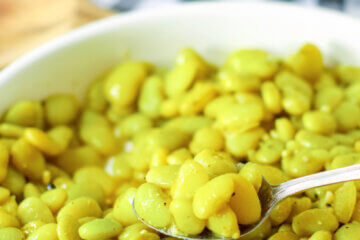 bowl of lima beans with spoon; text overlay "Cracker Barrel Lima Beans"