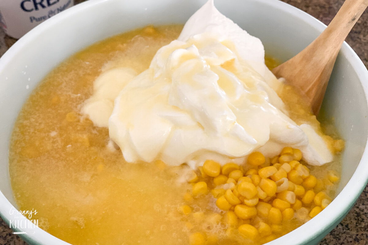 mixing bowl with corn and sour cream