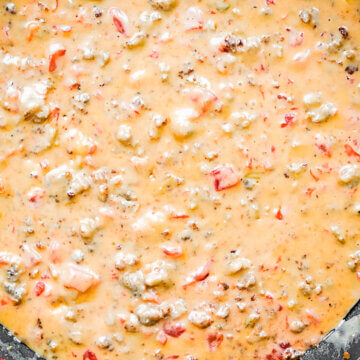 large skillet filled with cheesy Rotel dip