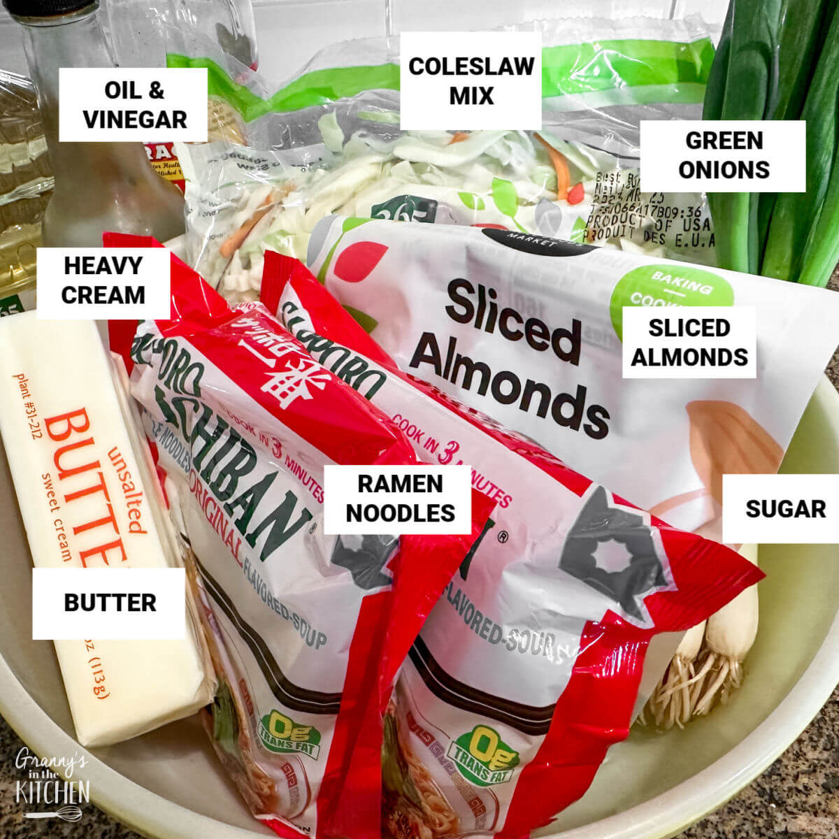 ingredients to make Asian inspired coleslaw, with text labels