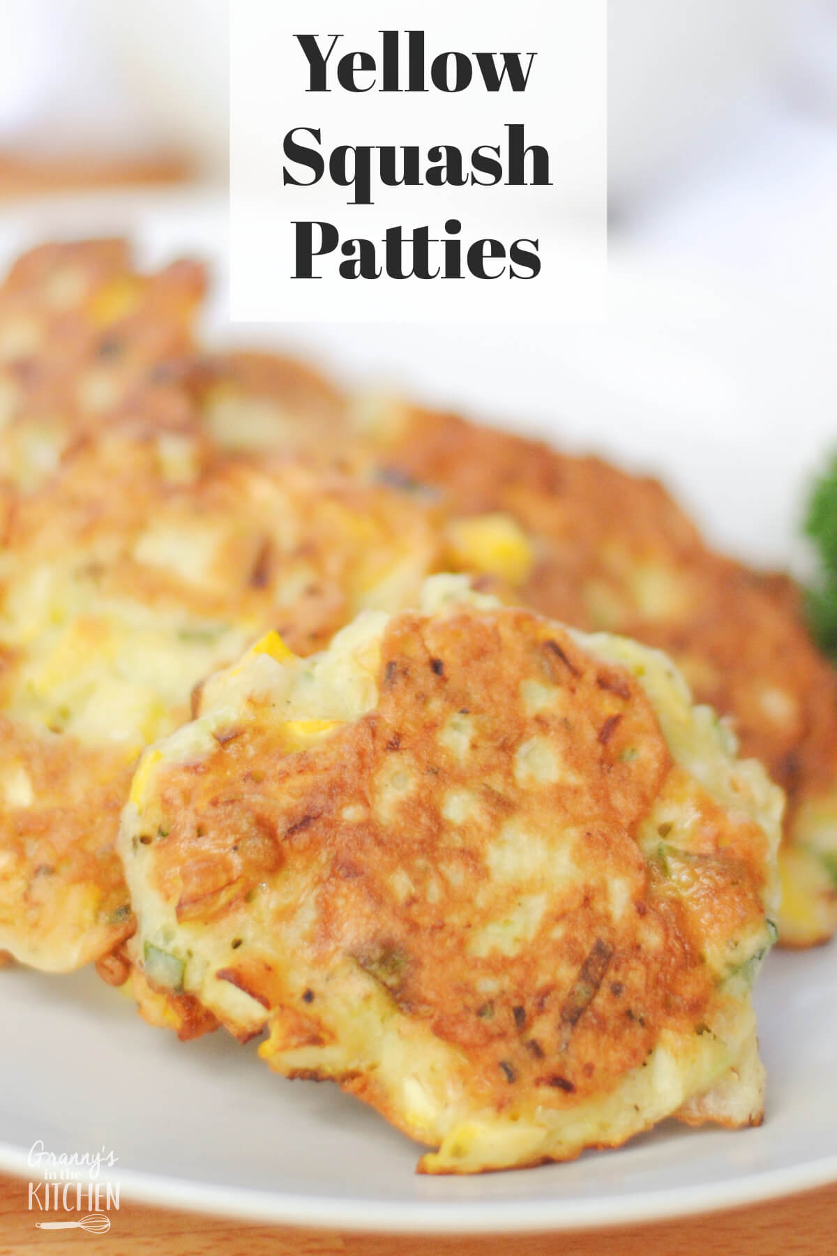 close up of a plate of squash fritters; text overlay "Yellow Squash Patties"