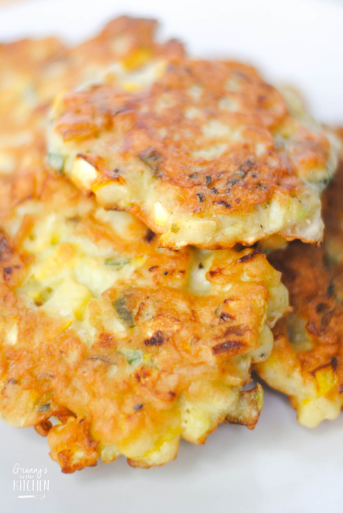 close up of a stack of homemade yellow squash patties