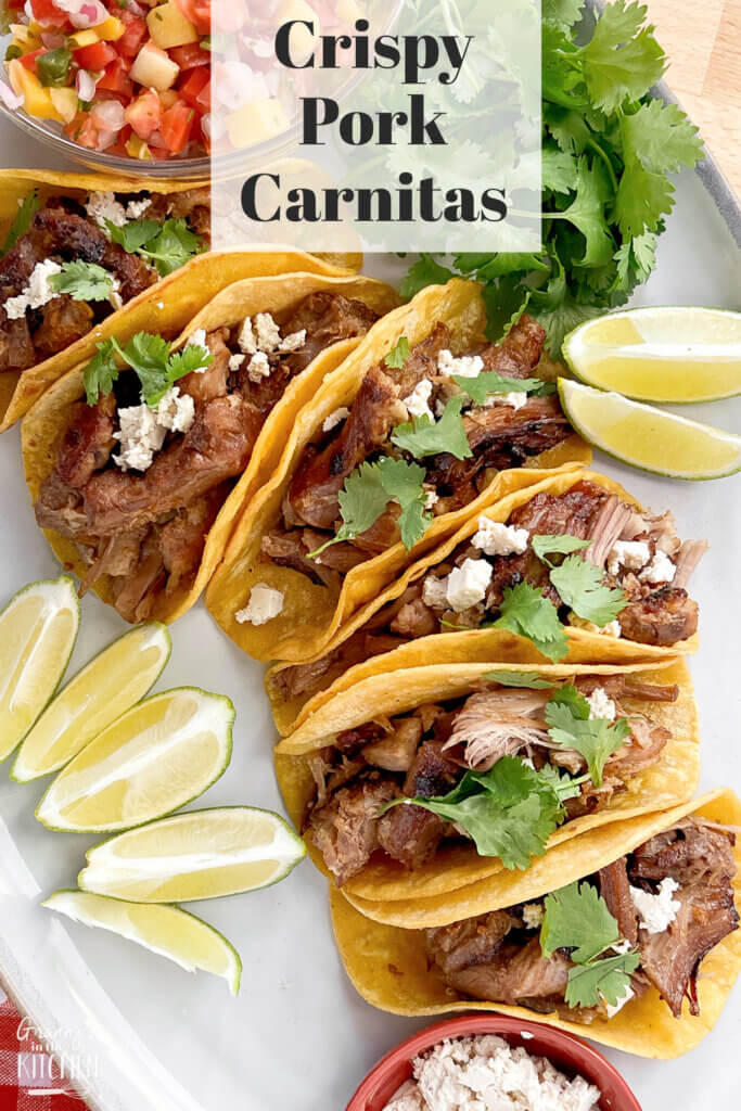 platter of shredded pork tacos; text overlay "Crispy Pork Carnitas"