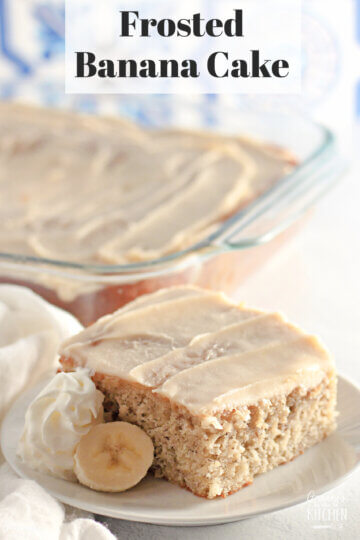 slice of iced banana cake with pan in background; text overlay "Frosted Banana Cake"