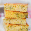 stack of cornbread squares; text overlay "Broccoli Cornbread"