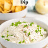 bowl of caramelized onion dip with chips in background and text overlay "French Onion Dip".