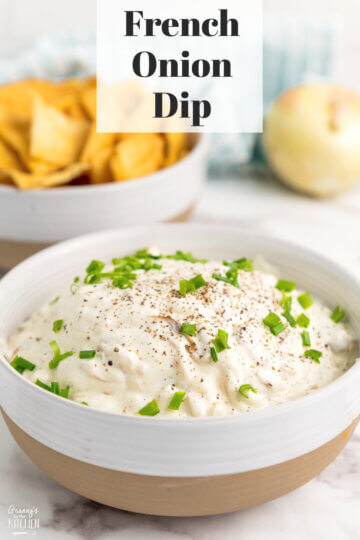 bowl of caramelized onion dip with chips in background and text overlay "French Onion Dip".