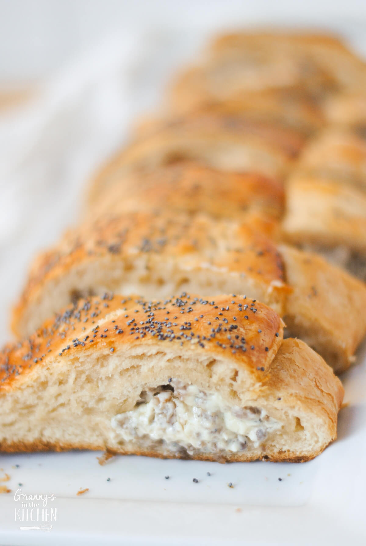 a loaf of crescent dough stuffed with melted cream cheese and sausage.