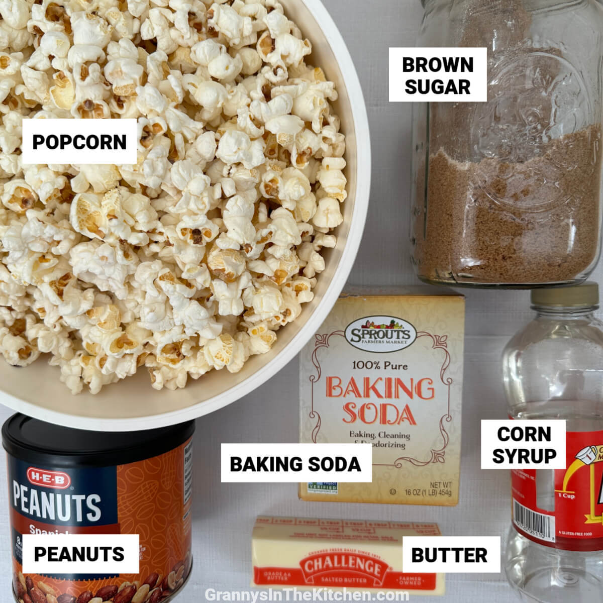 flatlay of ingredients to make Cracker Jack popcorn, with text labels.