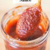 jar of homemade bbq sauce with spoon; text overlay "Homemade Barbecue Sauce".