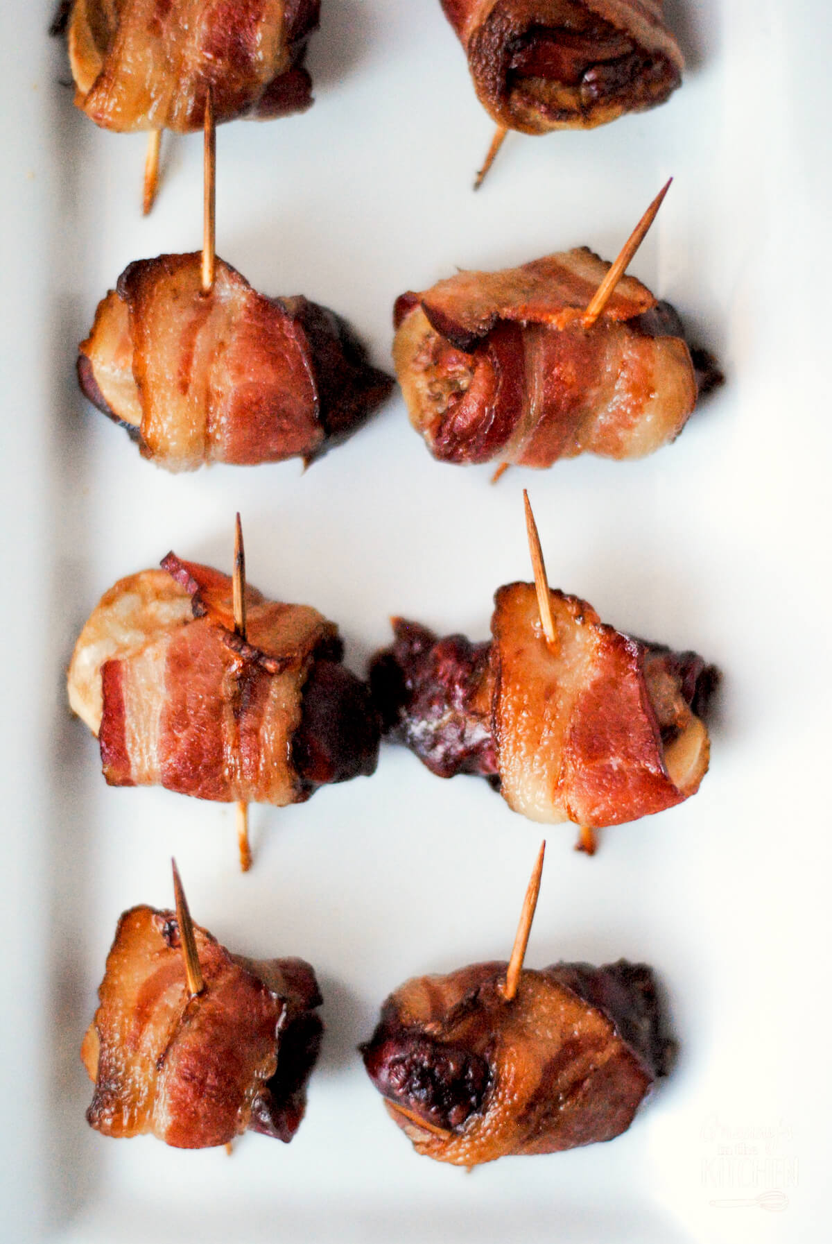 plate of Rumaki appetizer, wrapped in bacon.