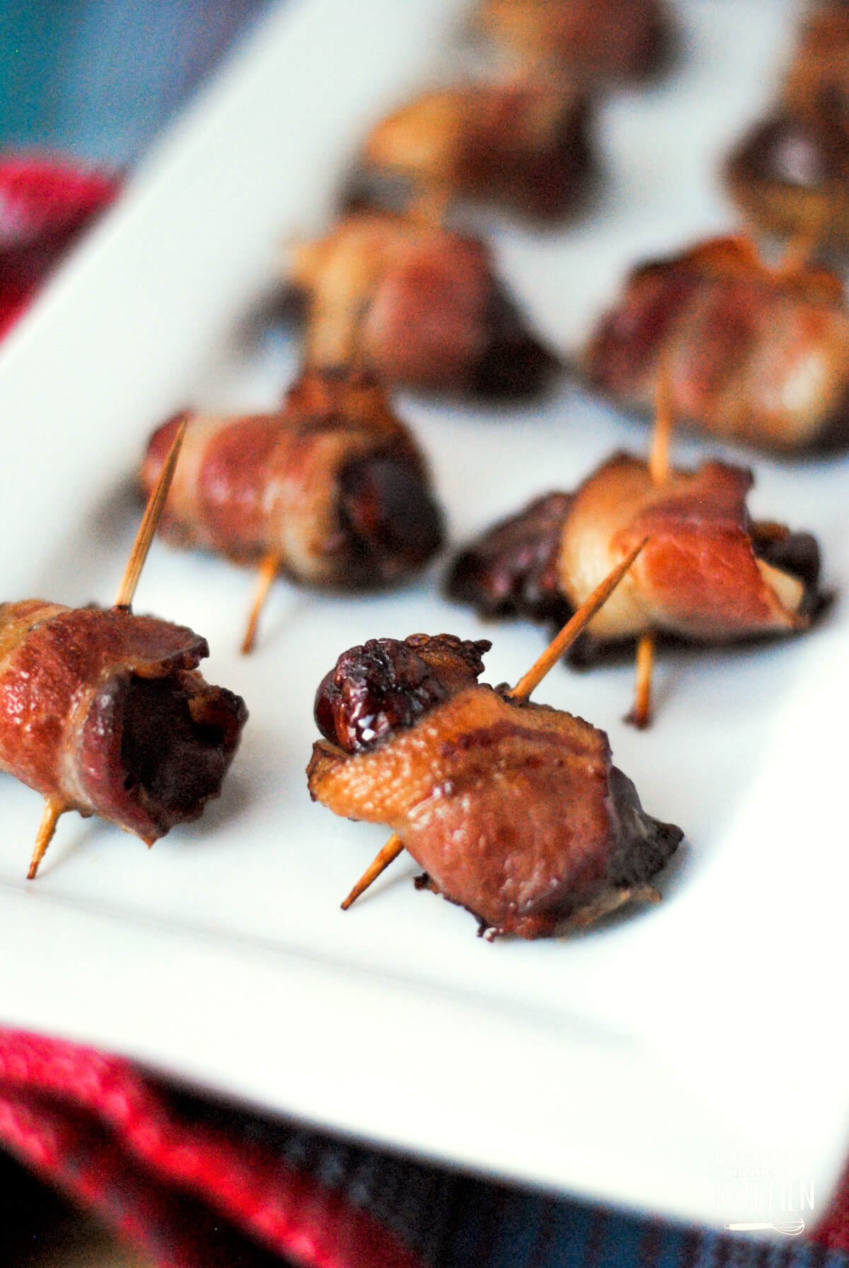 Rumaki appetizer made with chicken livers wrapped in bacon.